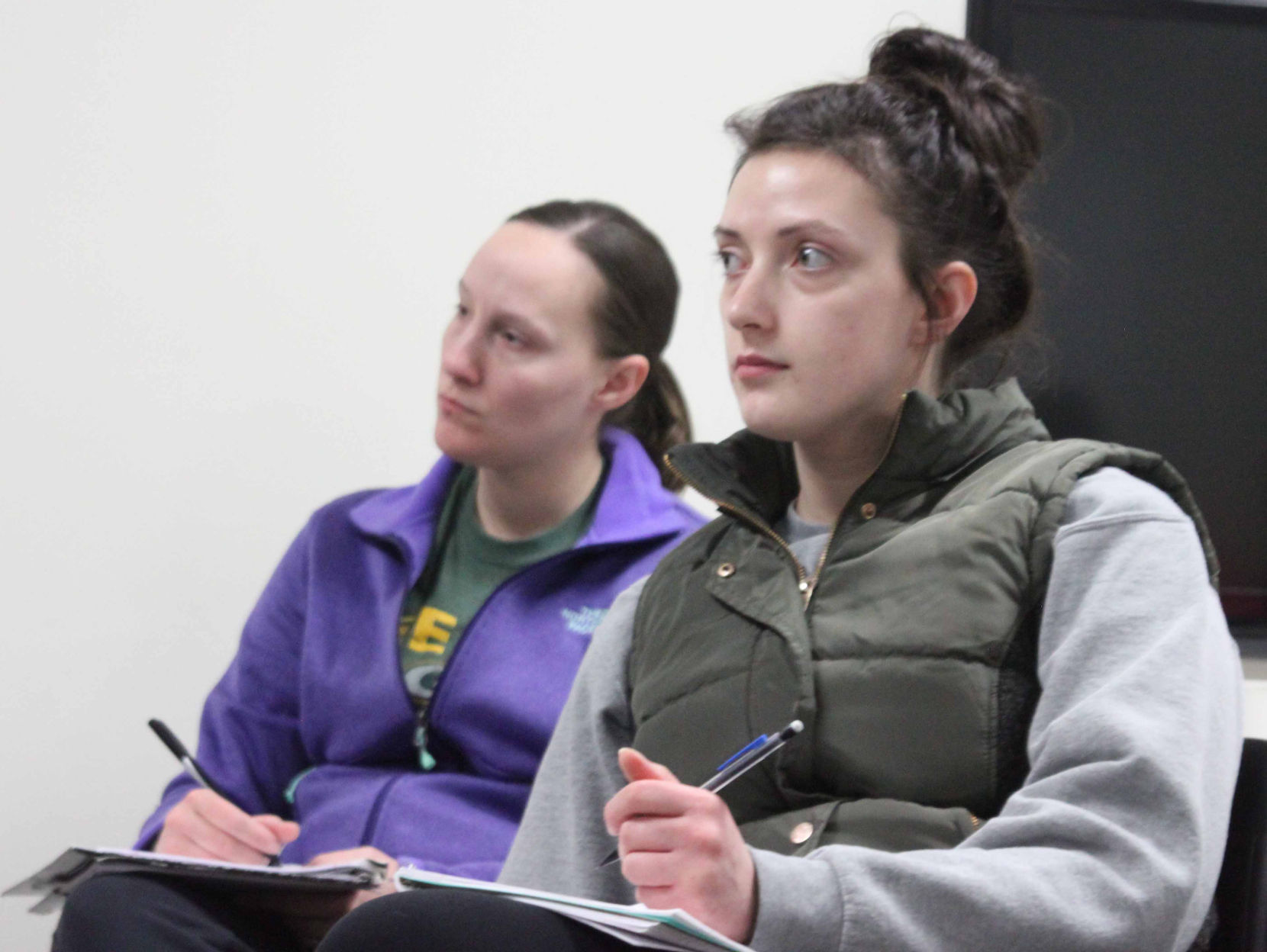 Shelby and Victoria listen to teacher